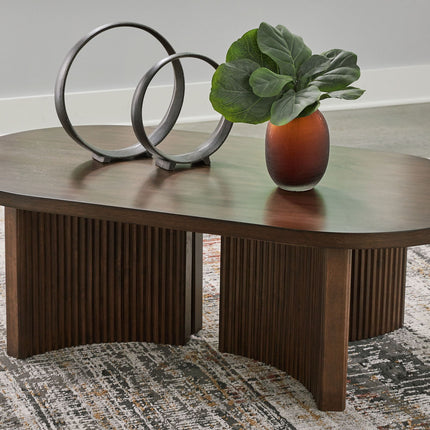 Korestone - Oval Cocktail Table - Dark Brown