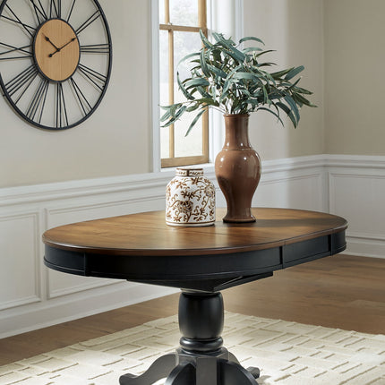 Clorazi - Oval Dining Room Butterfly Extension Table - Black / Brown